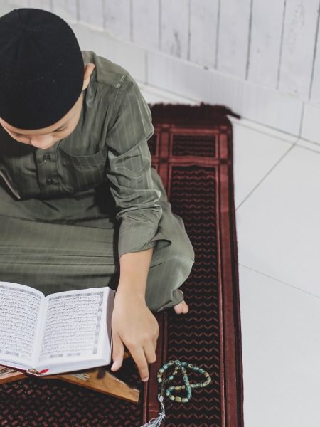 muslim-boy-reading-holy-quran-2021-08-30-06-01-29-utc-min.jpg